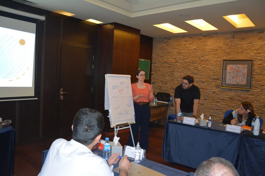 A DCD trainer leading a capacity-building session at a flipchart