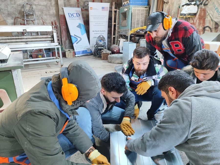 Air-ducts system vocational training with NRC — participants assembling ductwork